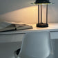 The 1980s black Saturn Desk Lamp in the style of Robert Sonneman
