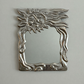 Sun face wall mirror by Donald Drumm